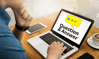 Customer browsing garbage bin rental questions and answers on laptop