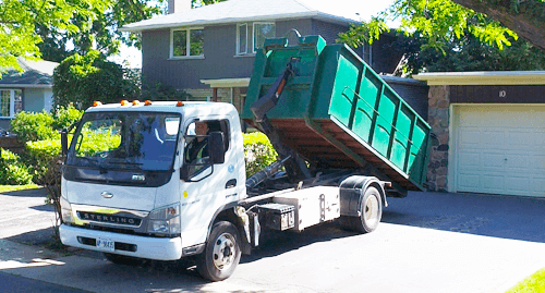 Flat Rate Bin 14-yard dumpster delivered to suburban driveway